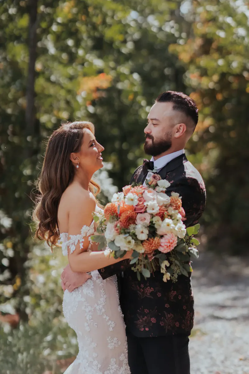 A newly engaged couple with her bouquet