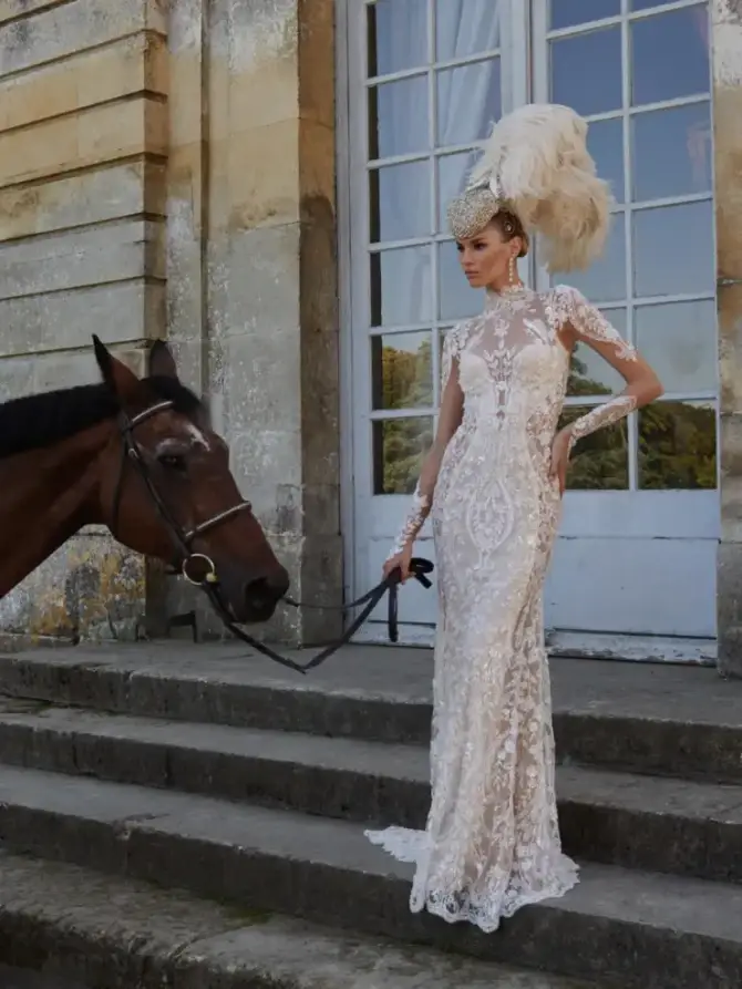 model is wearing an allover lace bridal gown by galia lahav