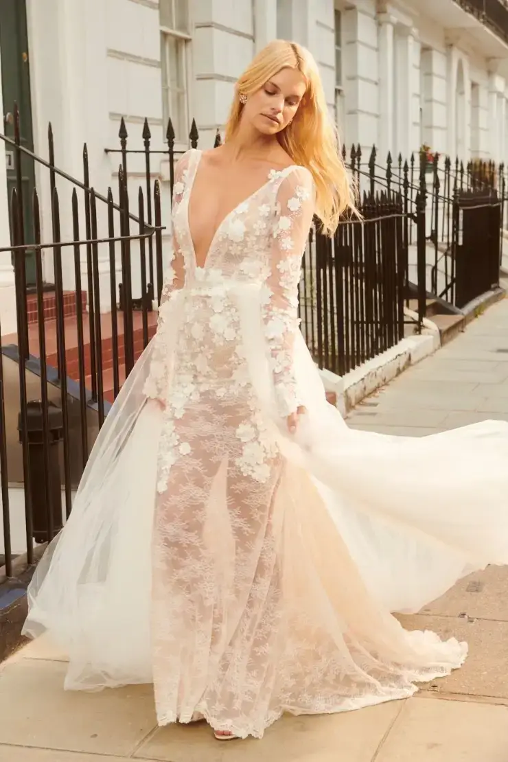 model is wearing an open back v-neckline a-line wedding dress